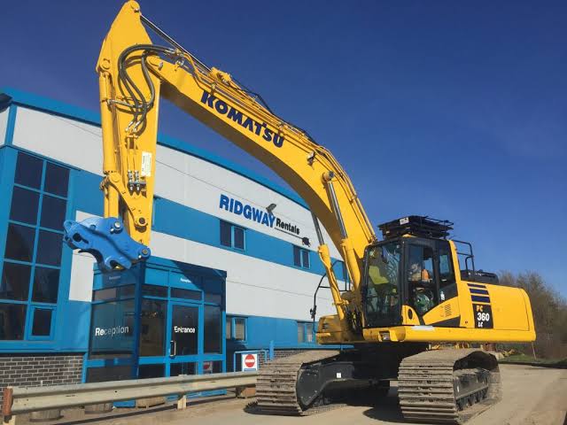 Excavator operator working on site